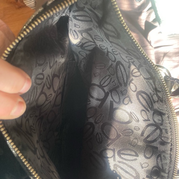I am selling my BEBE purse it’s very unique I’ve never used it once - Picture 4 of 8